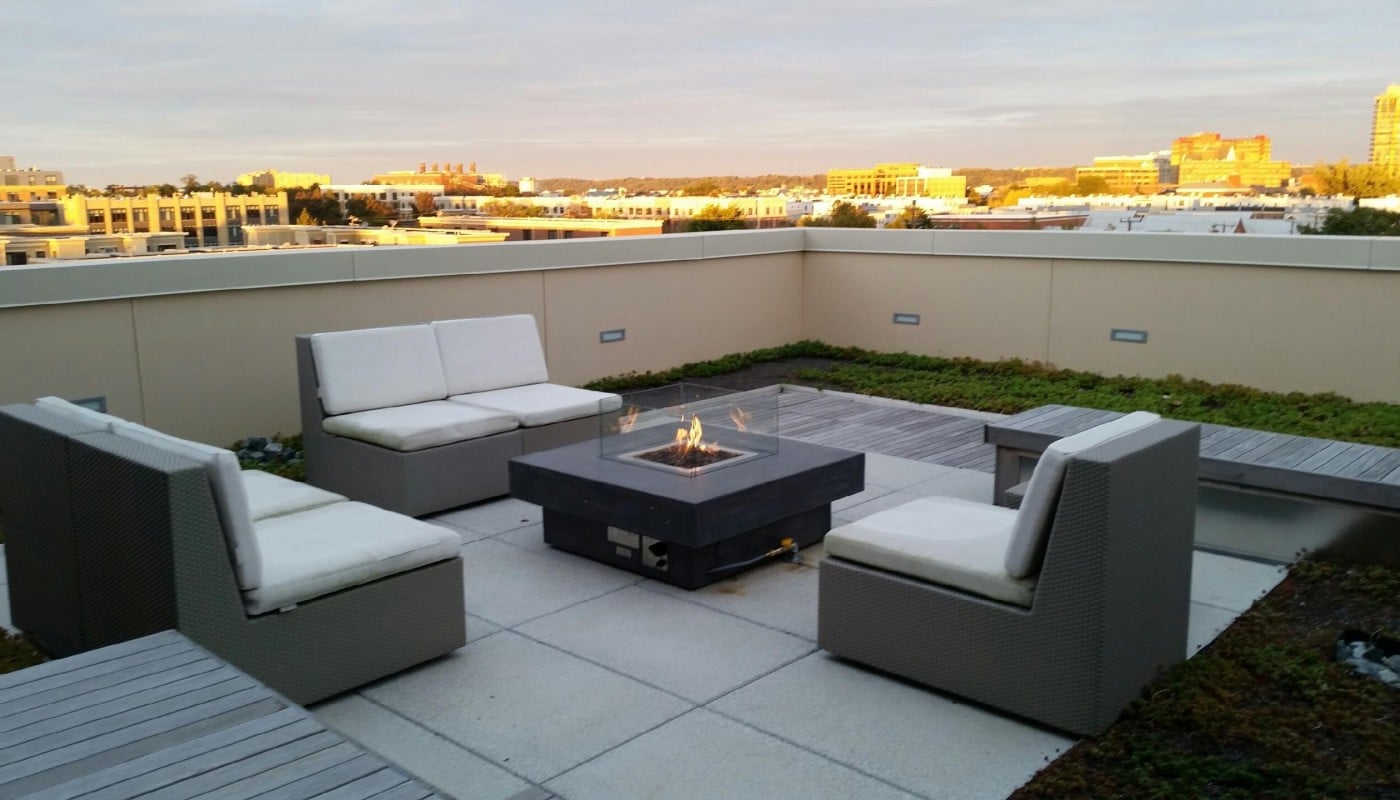 asher rooftop lounge with social seating, bench seating, view of alexandria and fire pit - jefferson apartment group