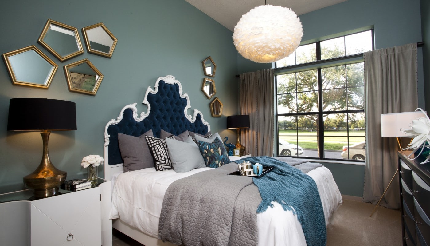 Azul bedroom with bed, night stands, dresser, modern lighting, lamps and large windows - jefferson apartment group