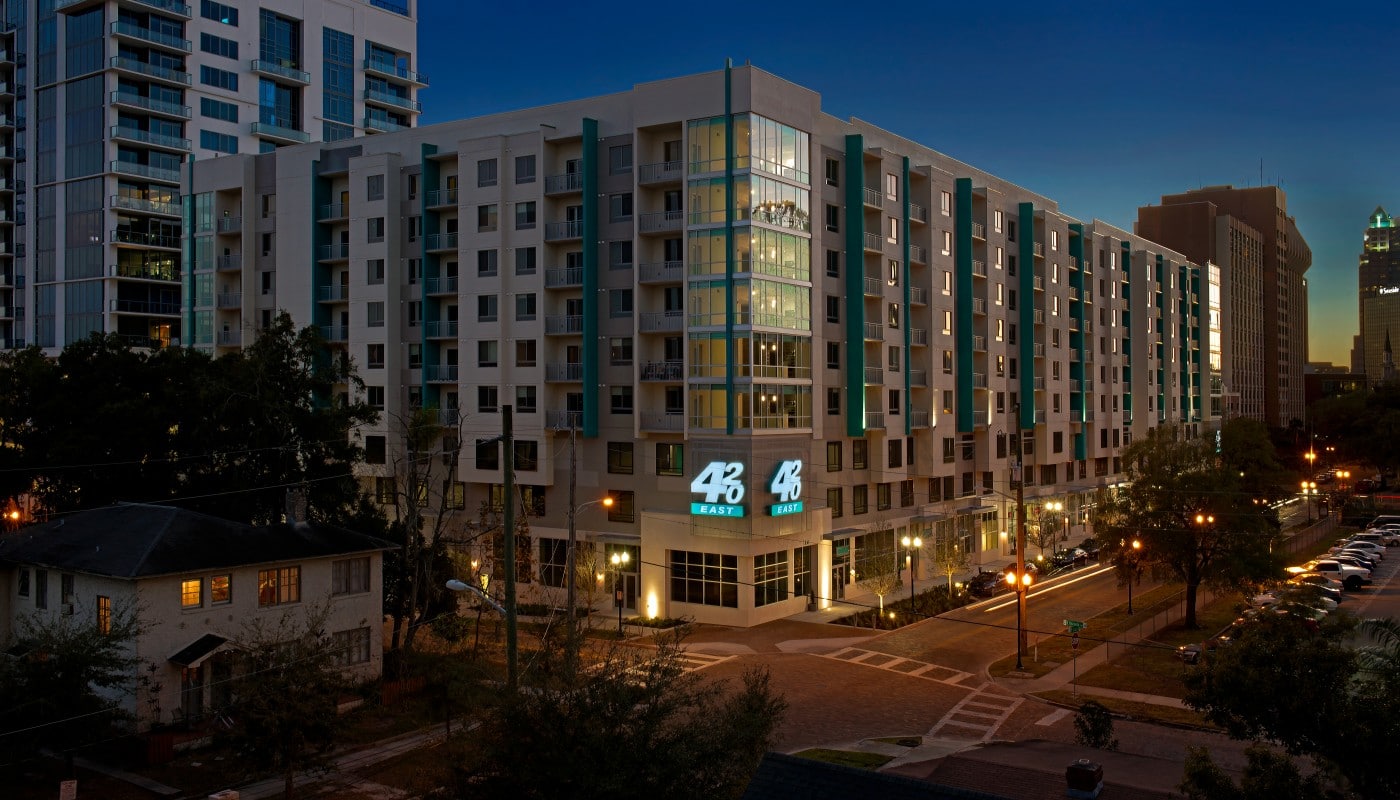 420 east apartment building exterior at night - jefferson apartment group