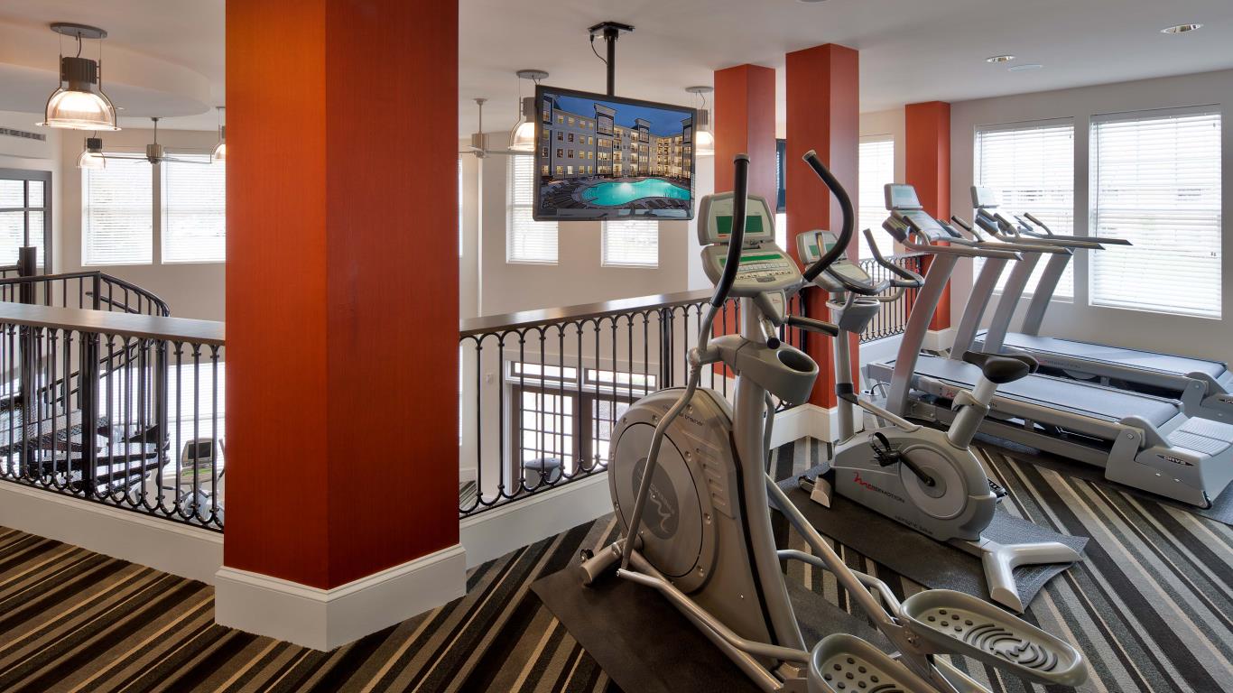 jefferson pointe fitness center with flat screen tv and cardio machines