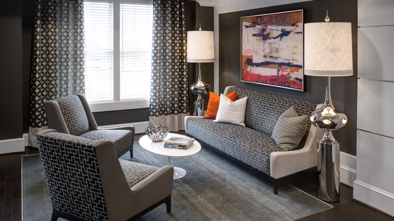 jefferson pointe at west chester resident lounge with couch, chairs, modern lamps and cocktail table - jefferson apartment group