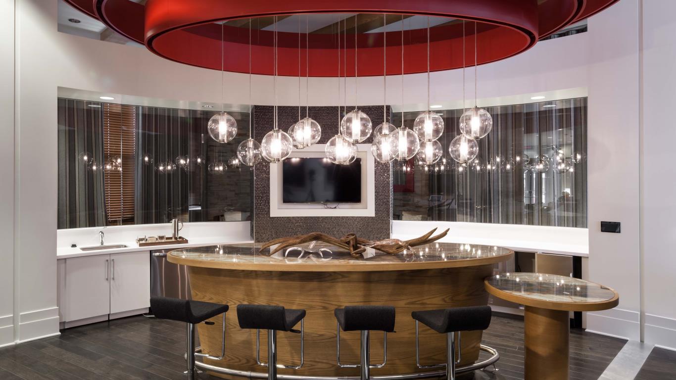 jefferson marketplace bar seating with flat screen tv and modern lighting - jefferson apartment group
