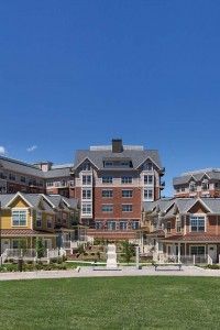 arlington 360 exterior showing apartment buildings, town homes, and resident lounge with green lawn and bench seating - jefferson apartment group
