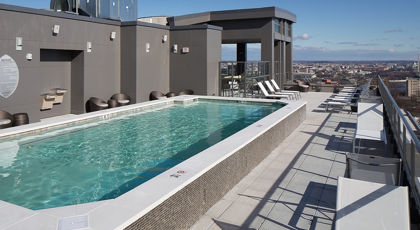 tellus rooftop pool with chaise lounge chairs, social seating and outdoor lounge - jefferson apartment group