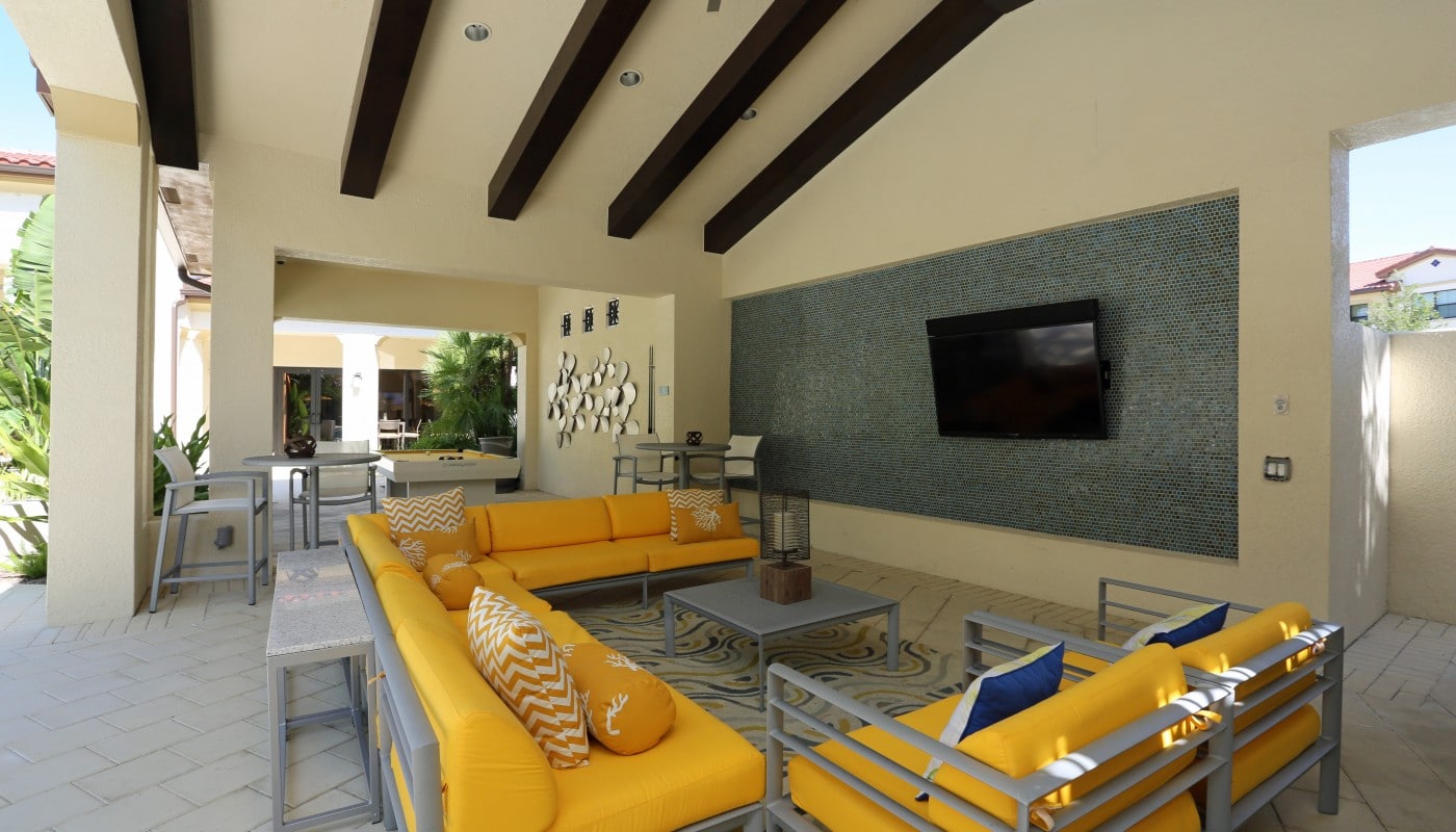 jefferson palm beach outdoor living area with social seating, billiards table and flat screen tv - jefferson apartment group
