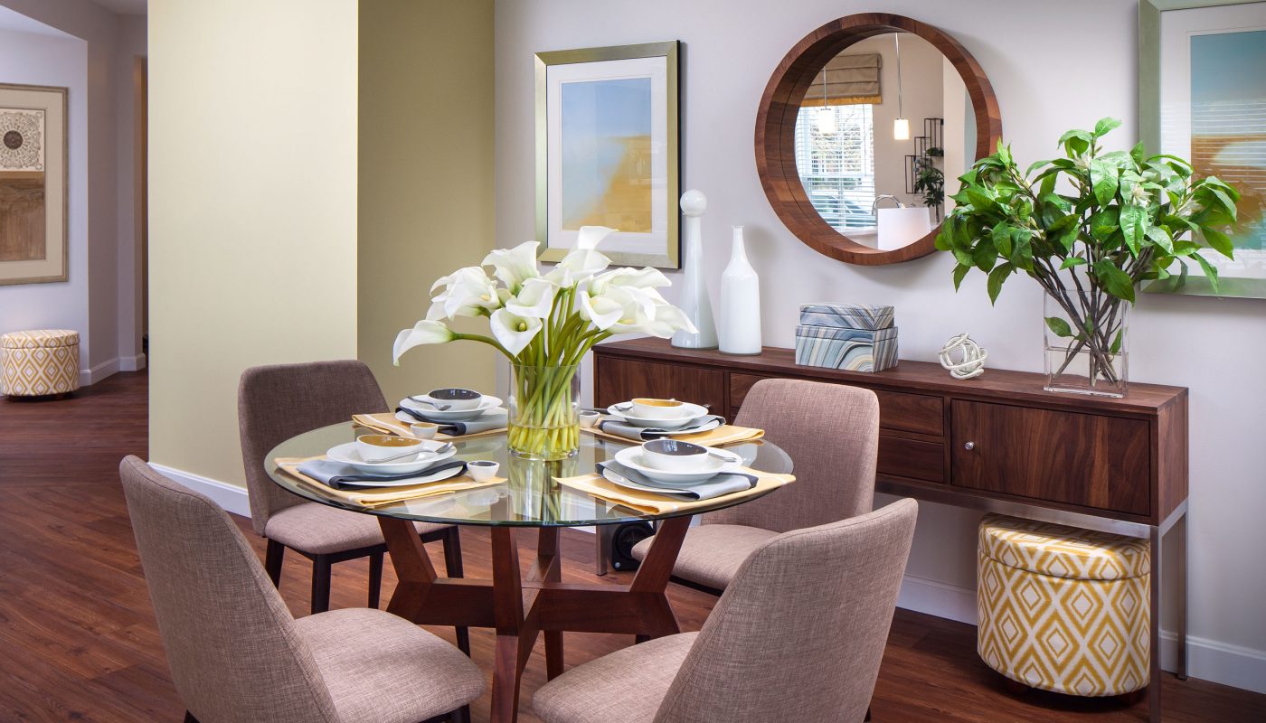one upland dining area with table, four chairs, place settings, credenza, mirror and view of foyer - jefferson apartment group