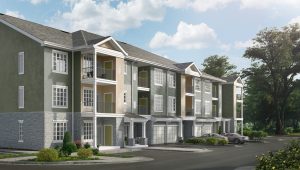 rendering of jefferson mount laurel apartment exterior showing three story building with balconies, private garages, and stone accents - jefferson apartment group