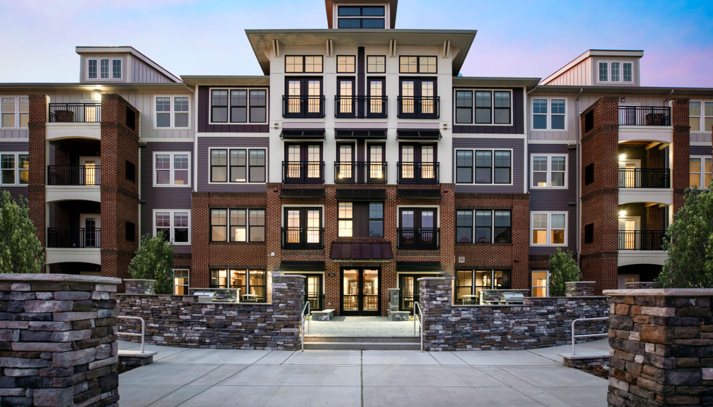 j creekside exterior with balconies and stone accents - jefferson apartment group