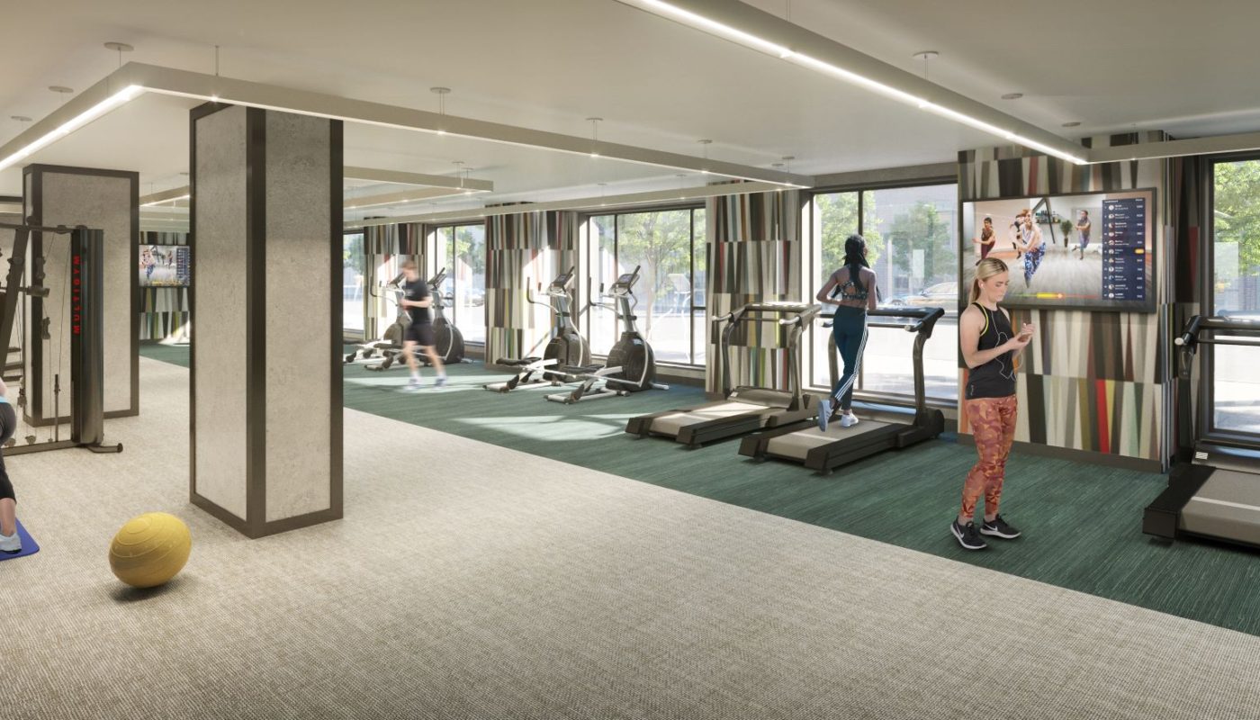 people working out at the j vue fitness center and yoga studio at j vue apartments in boston ma