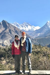 jim and cynthia butz in front of mount everest - jefferson apartment group