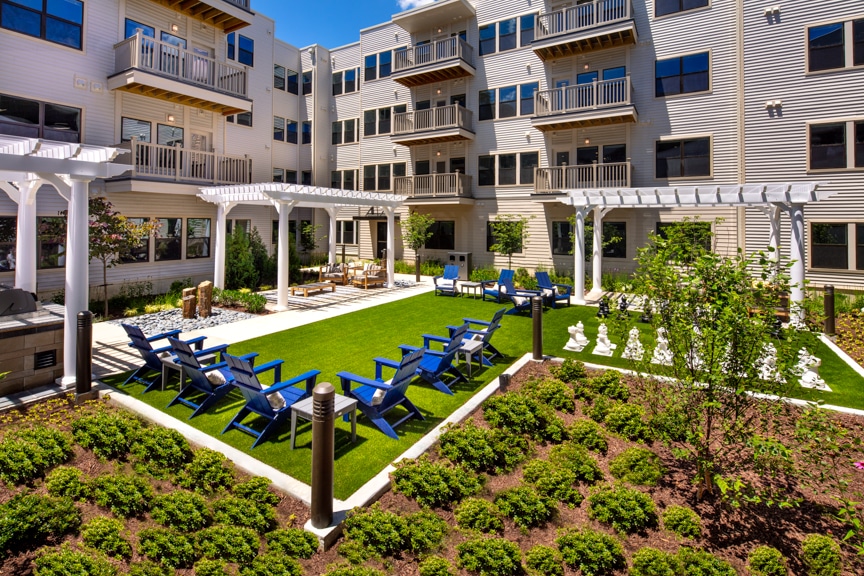 Courtyard with social seating and large chess board at atelier luxury silver spring apartments