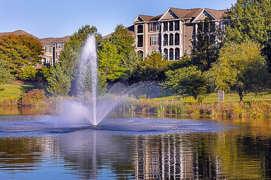 water feature, trees and building exterior - jefferson somerset park apartments