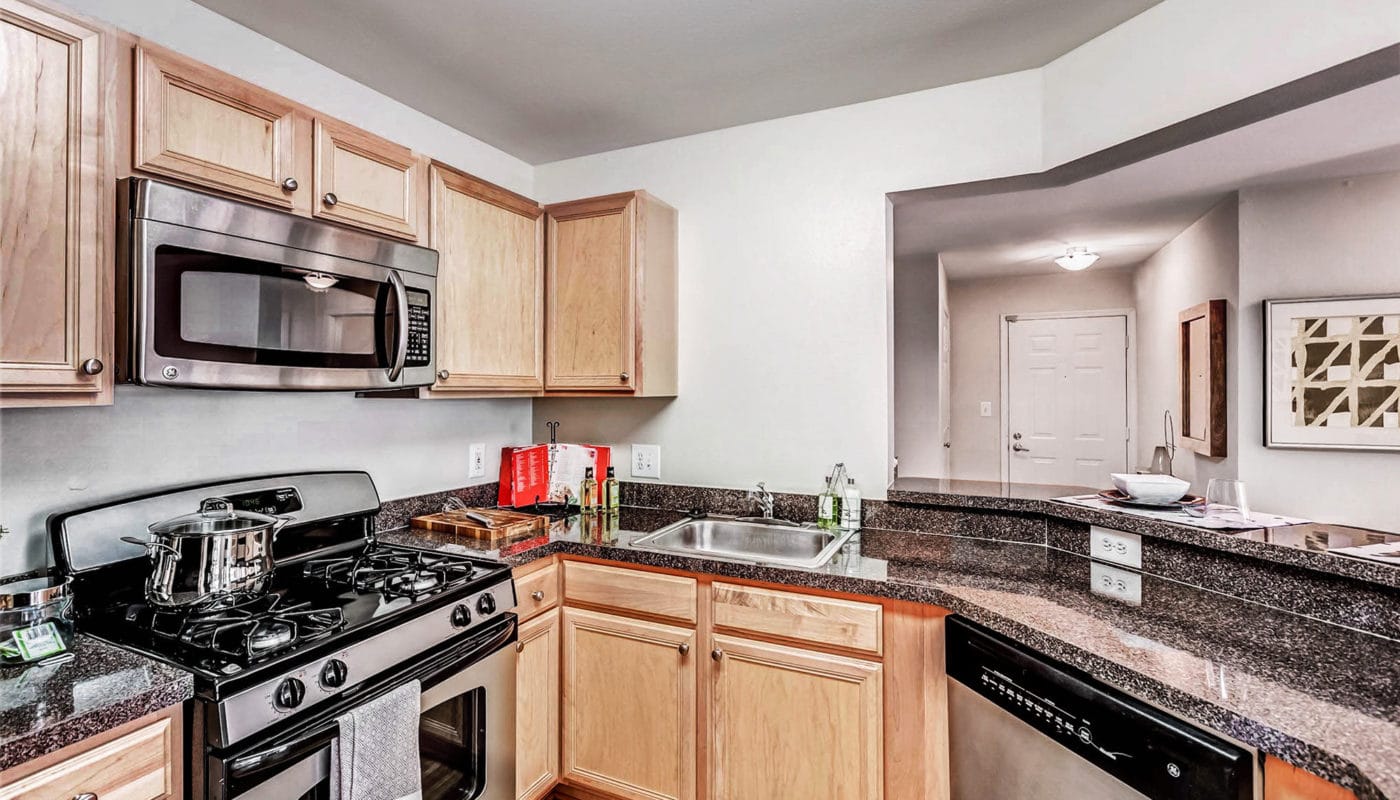 kitchen with stainless steel appliances - J Harbor Park reston va apartments