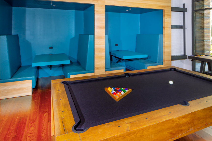 billiards and colorful booth seating