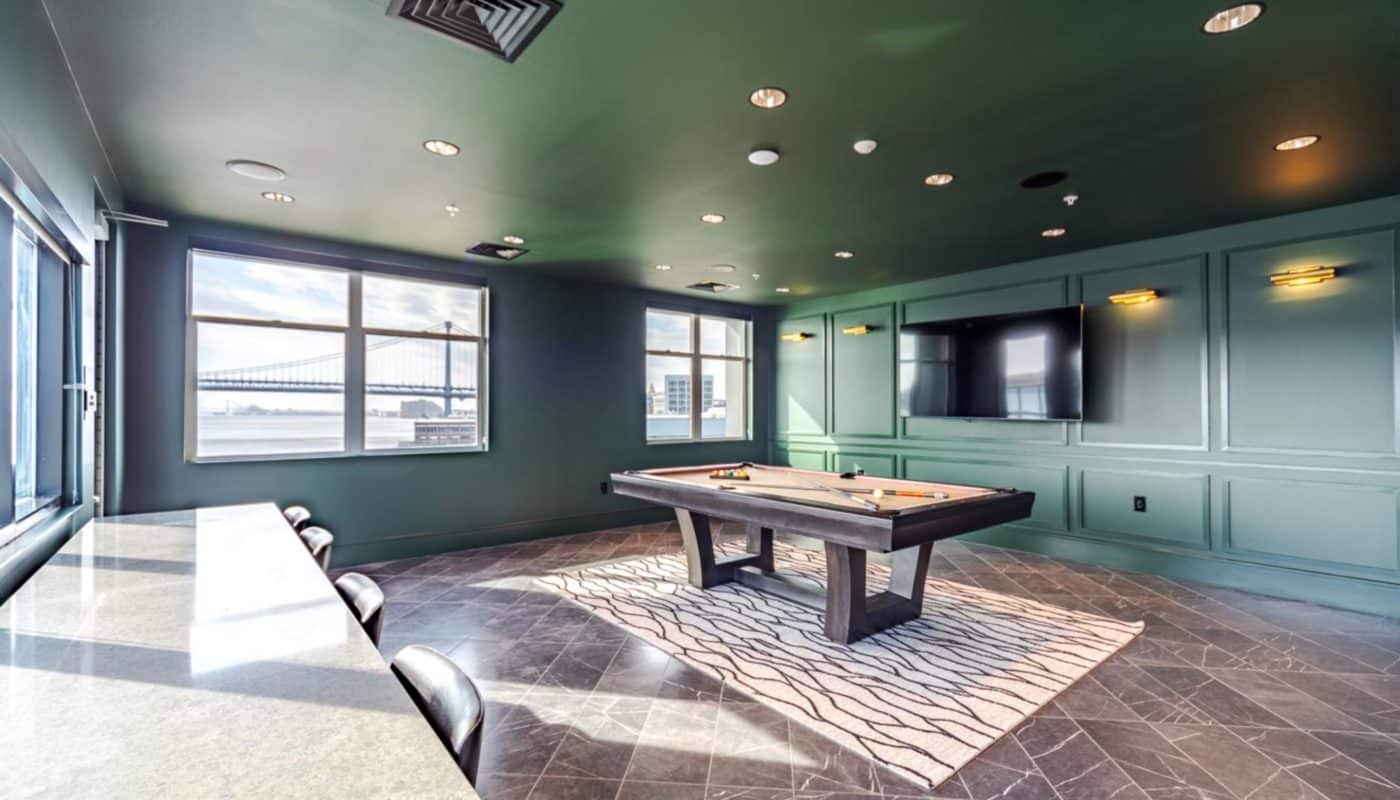 clubroom pool table, chairs and tv Rivermark Northern Liberties waterfront apartments Philadelphia PA