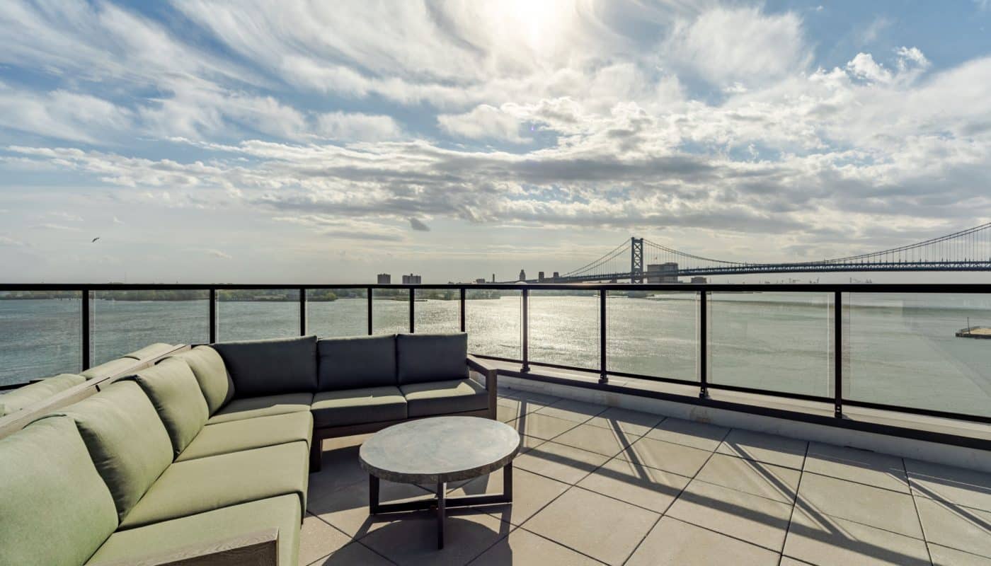 outdoor couch and table by the water Rivermark Northern Liberties waterfront apartments Philadelphia PA