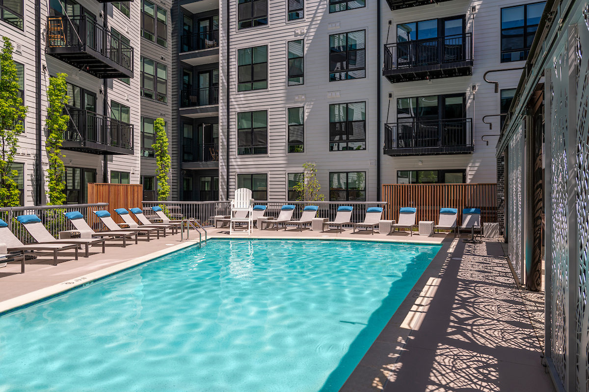 pool with chaises - aventon crown apartments