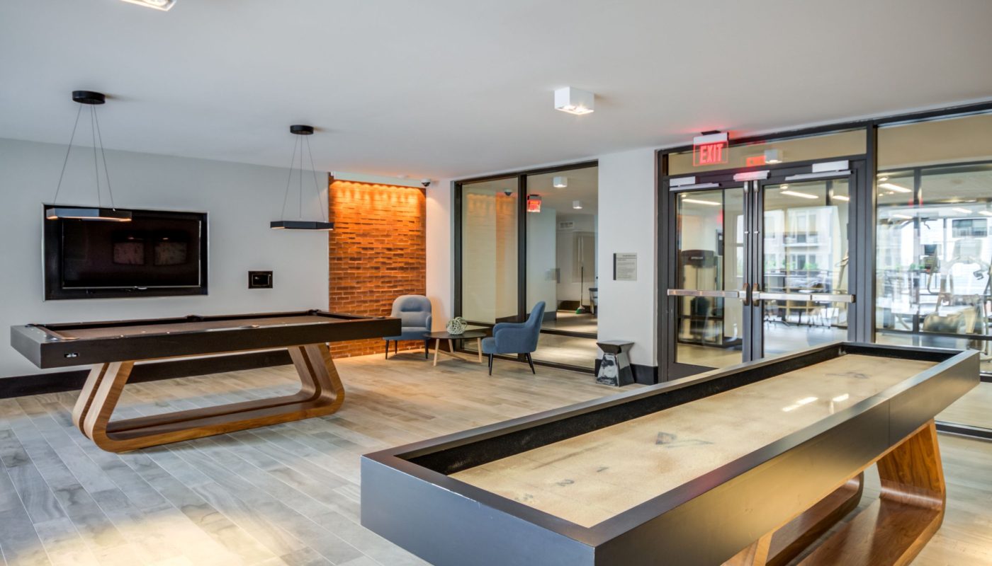 game room with billiards and shuffleboard - The Met Rockville