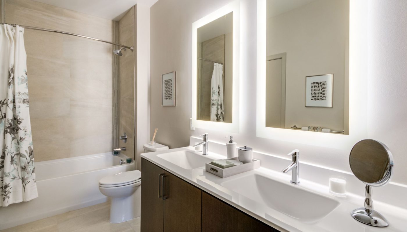 bathroom with led double vanity - The Met Rockville