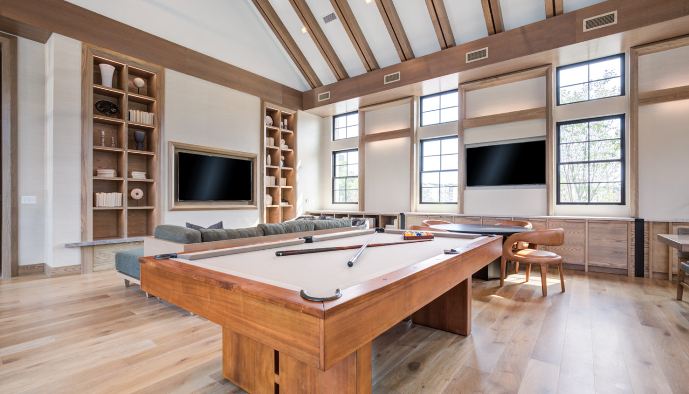 pool table by chairs and TVs EDE luxury apartments Frederick MD