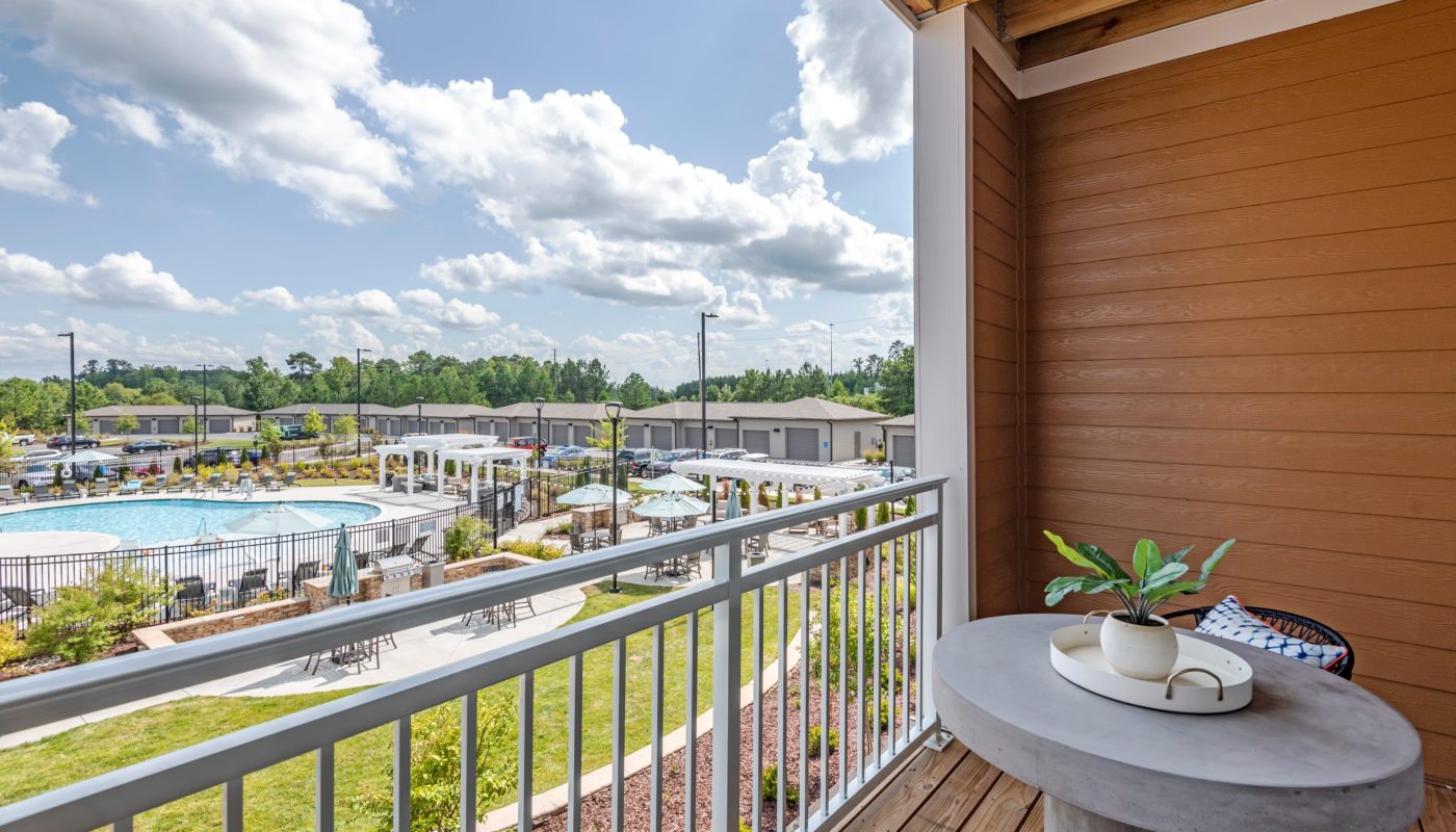 balcony with pool view Flats at 540 Apartments JAG Management Company