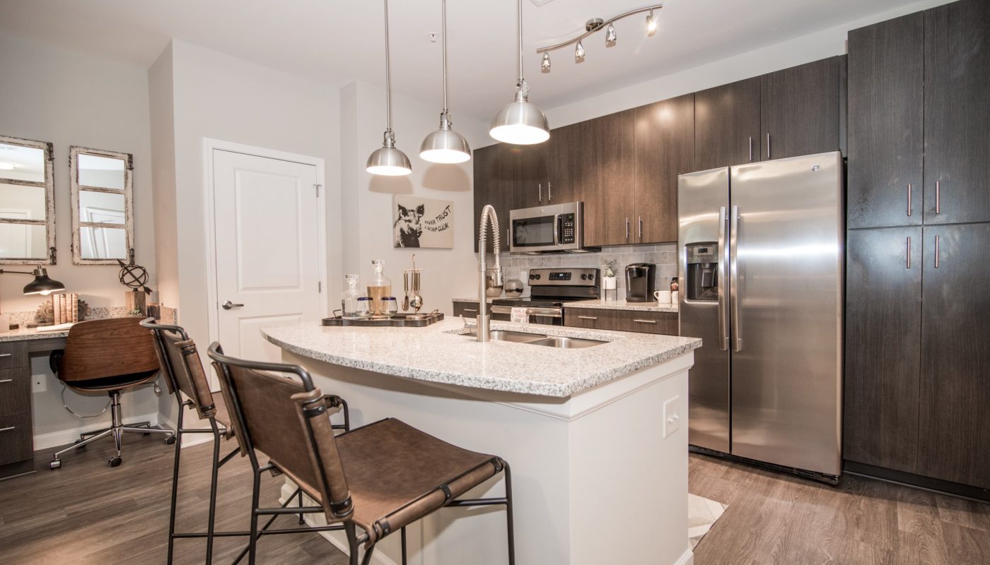 Lodge at Croasdaile Farm Kitchen wwith dark brown cabinets and granite countertops