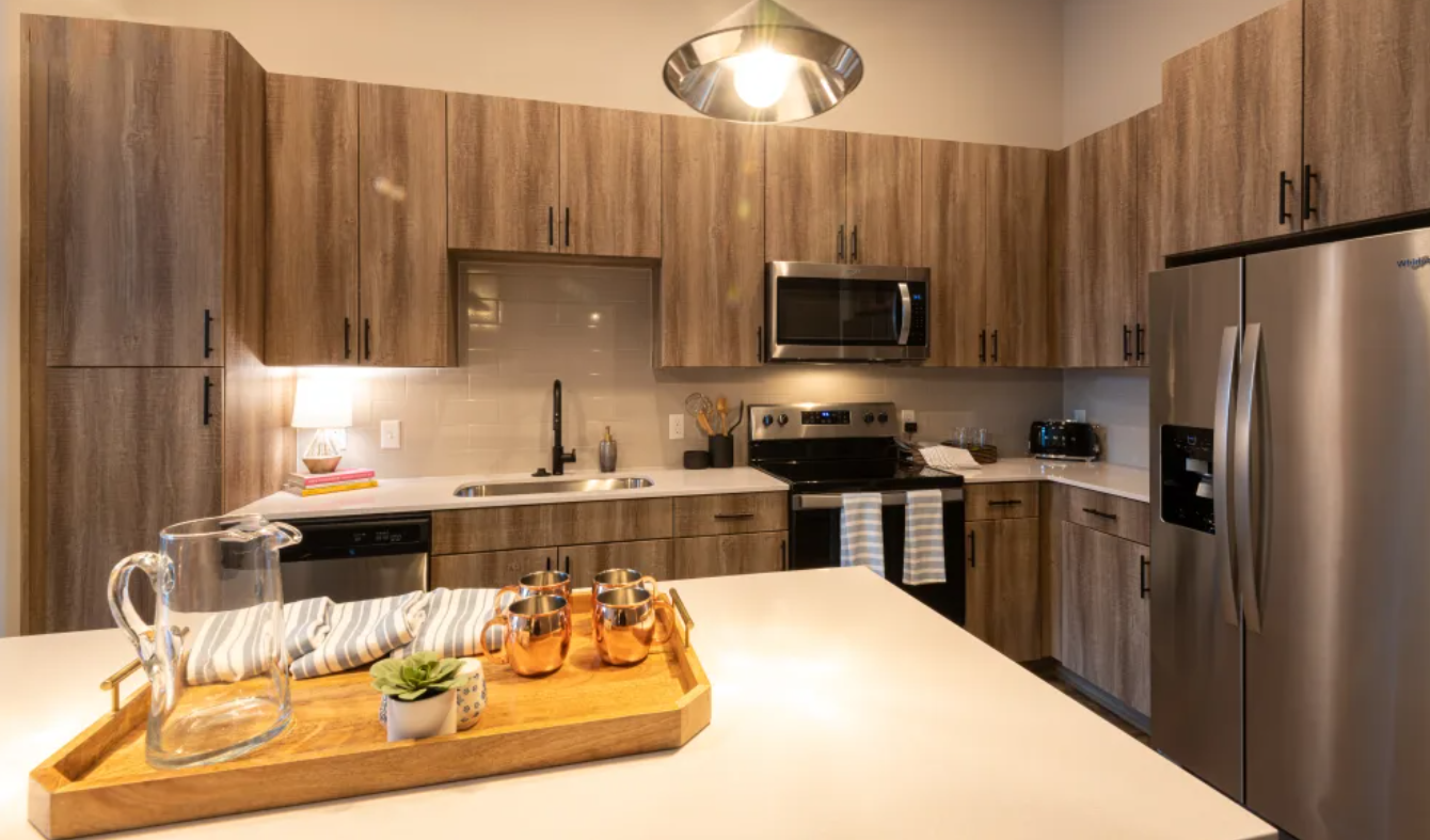 Reserve at Patterson Place Kitchen with stainless appliances and quartz counter tops